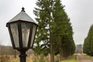 Vintage black lantern on a city street
