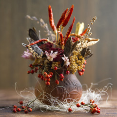An autumn bouquet of dried flowers and fruit