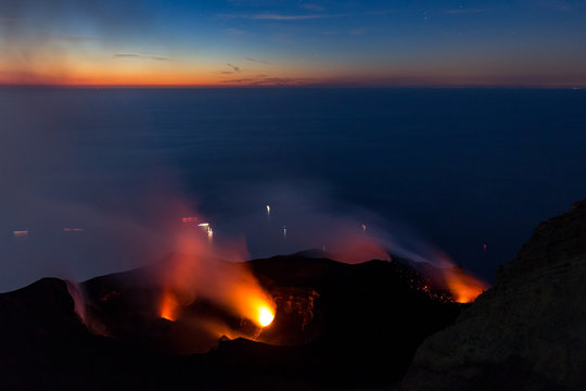 Glowing fumaroles at the summit of Stromboli vulcano, Italy, at sunset.
