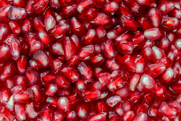 Full frame shot of fresh, red pomegranate seeds