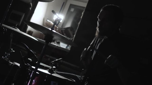 Close Up Of Drummer Playing Drum Kit In Studio, drum show repetition in dark nightclub