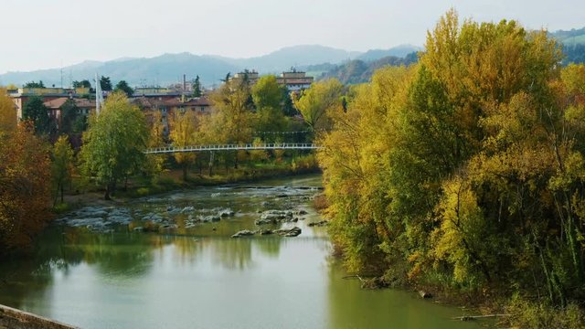 peaceful autumn river city tranquil landscape fall footbridge reno river Bologna - Casalecchio di Reno - Italy