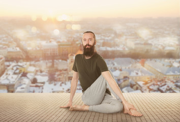 Fototapeta na wymiar Young man practicing yoga on white background