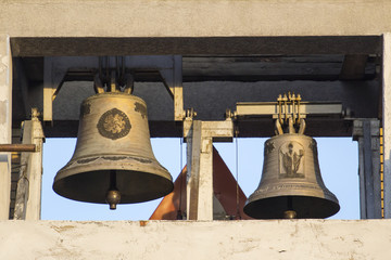 Obraz premium church bells lit by the sun