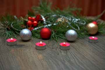 Red candle with fire against defocused lights