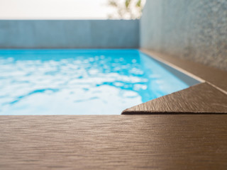 swimming pool with artificial wood deck