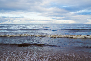 Landscape sea waves and cloudy -natural elements water Ocean waves. Wild sea storm - hazardous weather. The waves lapping on the shore. 