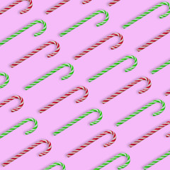 Christmas candy cane on a bright background. The minimal concept.