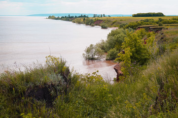 The shore of the Volga in the summer. Beautiful view, the high bank of the Volga River in Russia in the summer.