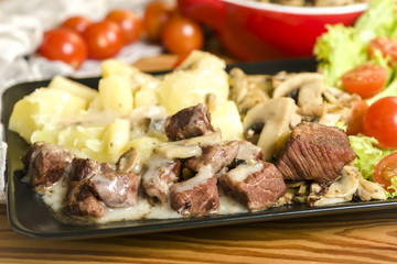 Stewed pork in mushroom sauce