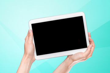 hands holding a tablet