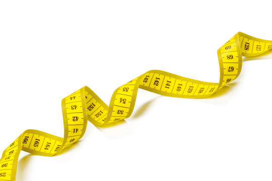 yellow metric measuring tape isolated on white panorama background