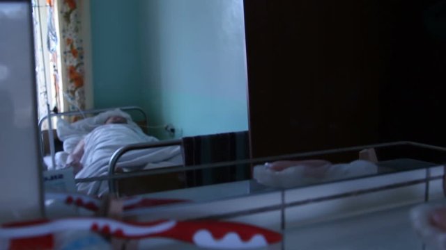 the man after the surgery lies in the hospital