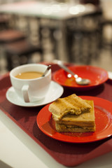 A close-up view of a morning breakfast set in a cafe.