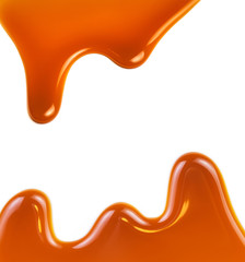 Sweet caramel sauce isolated on white background close up. Golden Butterscotch toffee caramel...