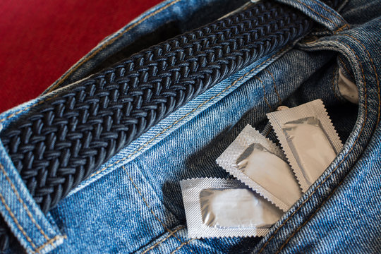 Condoms in the pocket of man's jeans