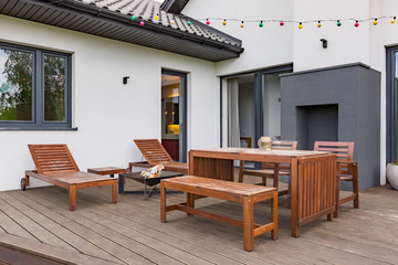Patio with wooden furniture set
