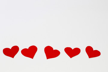 Fototapeta na wymiar Set of red hearts with flat design on light background