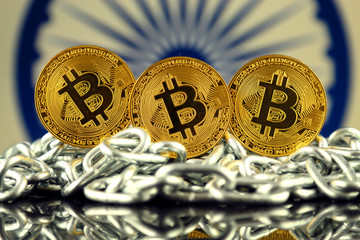 Physical version of Bitcoin (new virtual money), chain and India Flag. Conceptual image for investors in cryptocurrency and Blockchain Technology in India.