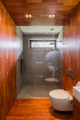 Wooden bathroom with shower