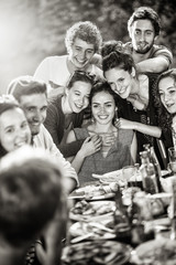 A group of students pose while a friend takes a picture