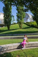 Obraz premium Fit middle-aged woman resting after training in park