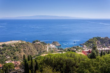 Obraz na płótnie Canvas panorama of the coast of Ionian sea from greek theater in Taormina in a summer day