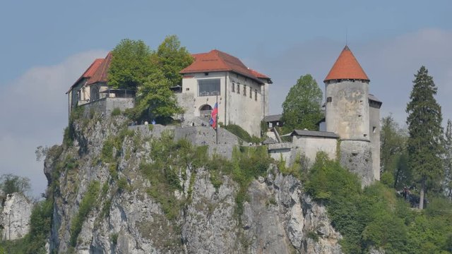 Bled Castel Time Lapse in 4K UHD UltraHD. Bled lake its castle and island with church is a Slovenia iconic place with terme and hotel. Tourists can rowing, boating and camping in the Alps scenery.