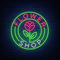 Flower shop logo, neon sign. Vector illustration on the theme of selling flowers. Neon banner, vivid advertising of flowers, night sign