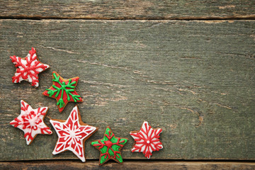 Christmas gingerbread cookies on grey wooden table