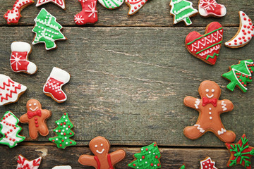 Christmas gingerbread cookies on grey wooden table