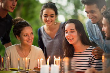  group of students celebrating a friend's birthday outside