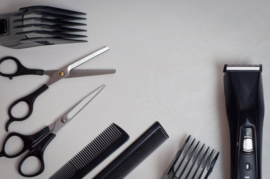 tools for a hairstyle: scissors, combs and a trimmer