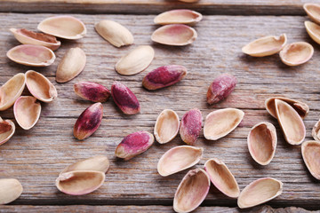 Pistachios on grey wooden table