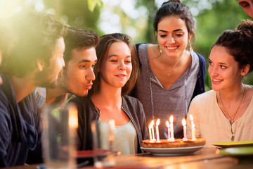  group of students celebrating a friend's birthday outside