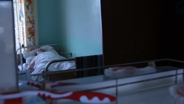the man after the surgery lies in the hospital