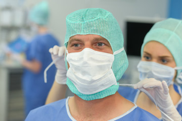 Fototapeta na wymiar surgeon getting ready to operate