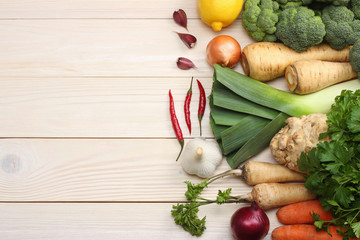 Fresh vegetables on white wooden background. Mockup for menu or recipe. Top view with copy space