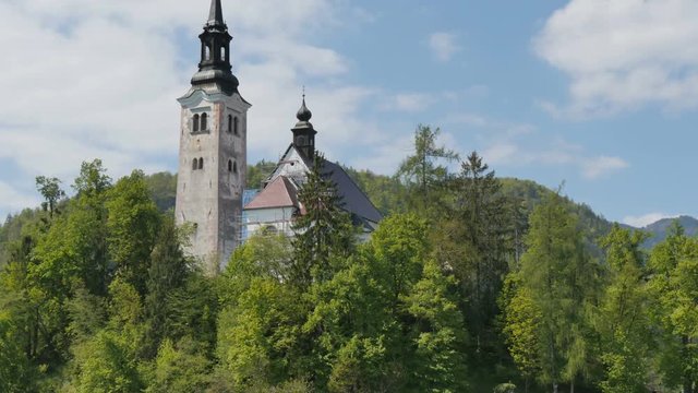 Bled Church Hyperlapse 4K Ultra High Definition. Bled lake its castle and iconic island with church is a Slovenia Alps turistic place with terme, hotel and beutiful landscapes. Bled 1 May 2017.