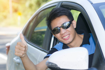 Man drive owner car smile happy enjoy thumb up for travel