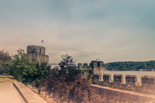 View of Rumelihisar is a fortress located in the Istanbul, Turkey on a hill at the European side of the Bosphorus. Old photo style.