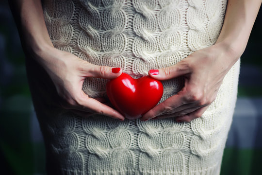 Hand female holding heart