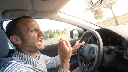 Angry Italian driver gesturing funny, road rage theme