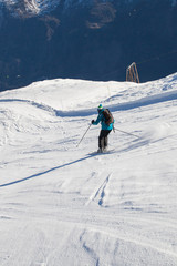 Fototapeta na wymiar Skier on slope in Frech Alps, Chamoinx valley