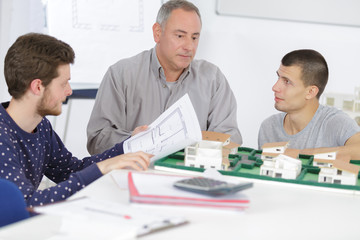 teacher with students in architecture school