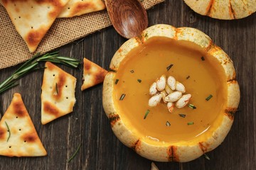 Pumpkin squash Soup served in mini pumpkin bowl / Thanksgiving food,top view