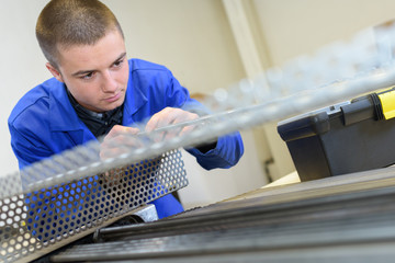 young man metallurgist at work