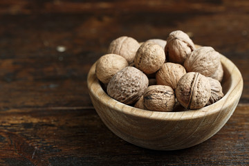 walnuts in a wooden plate