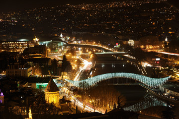 Fototapeta na wymiar bridge of peace in Tbilisi, night view