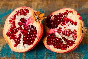 Healthy fruit red ripe pomegranate, rich of Vitamin C, also known as a symbol of prosperity, fertility and used in traditional medicine
